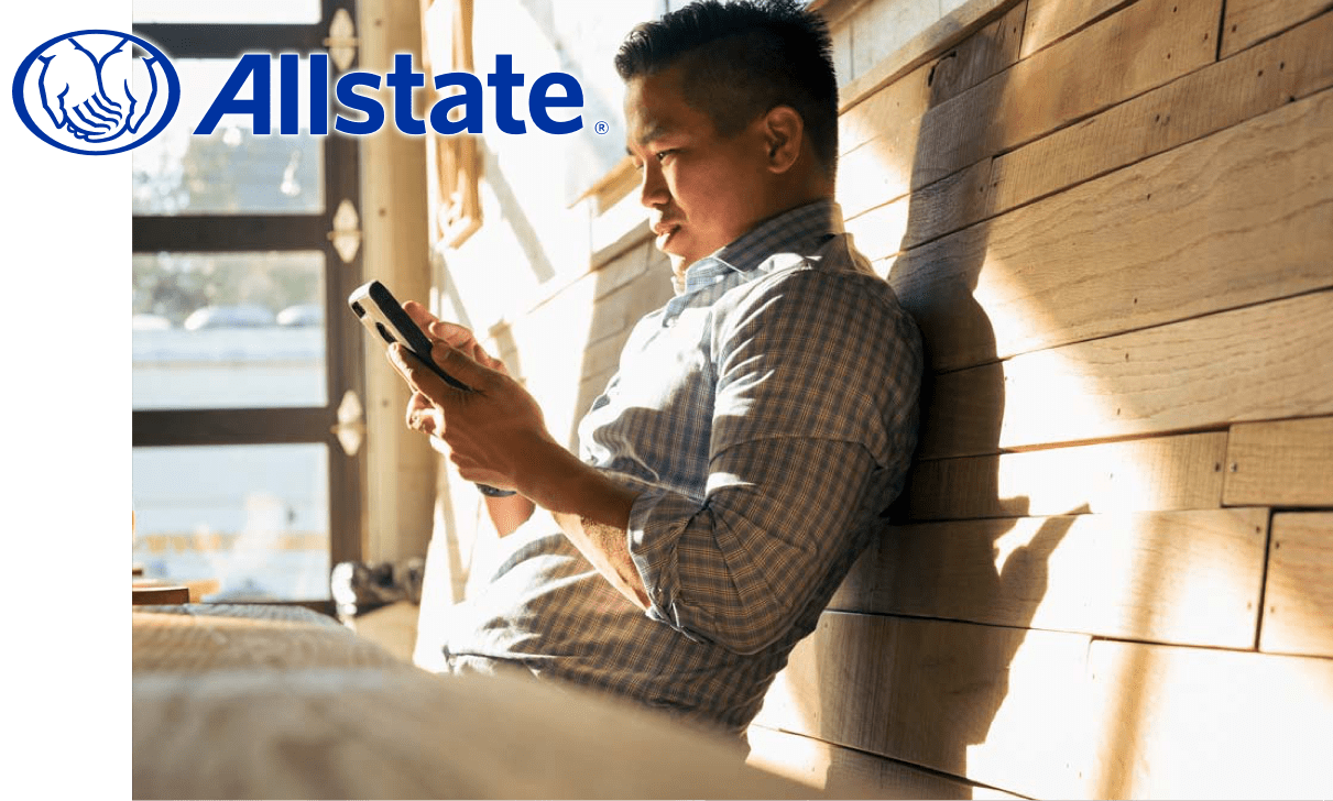 Man checking Allstate app on phone.